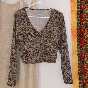 “gaze” Long-sleeve, cropped, cheetah print, top. Size Medium.
